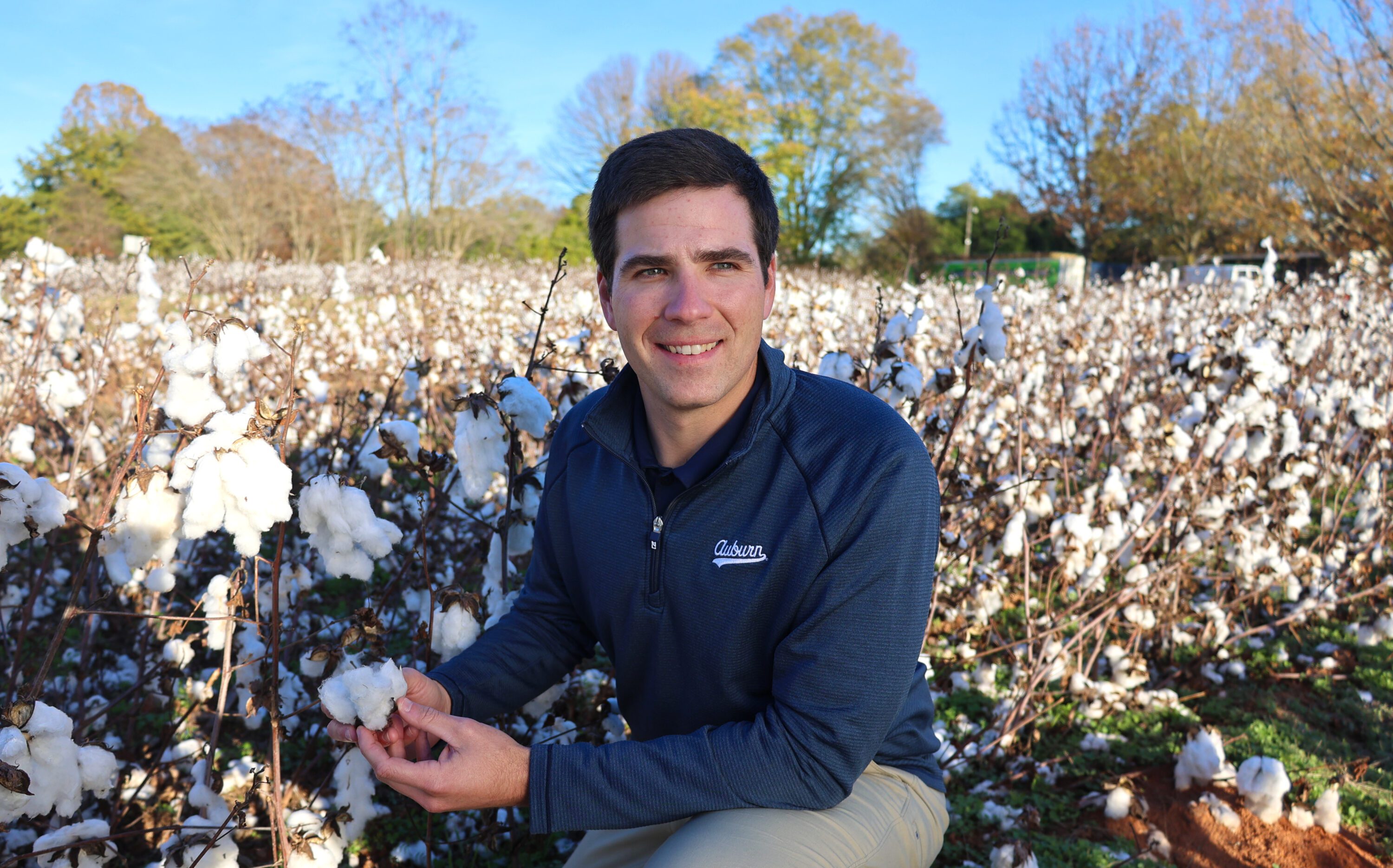 Scott Graham in a cotton field at harvest time.