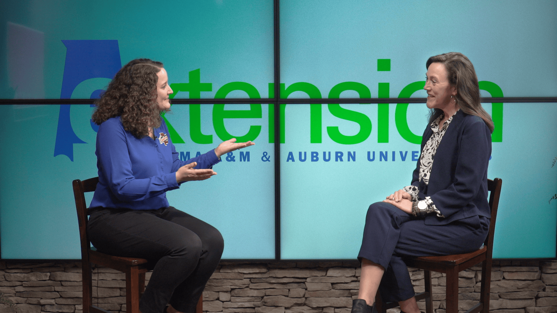 TV host on air speaking to ACES Extension Director, Eve Brantley