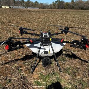 An agricultural drone with the dry spreader attachment.